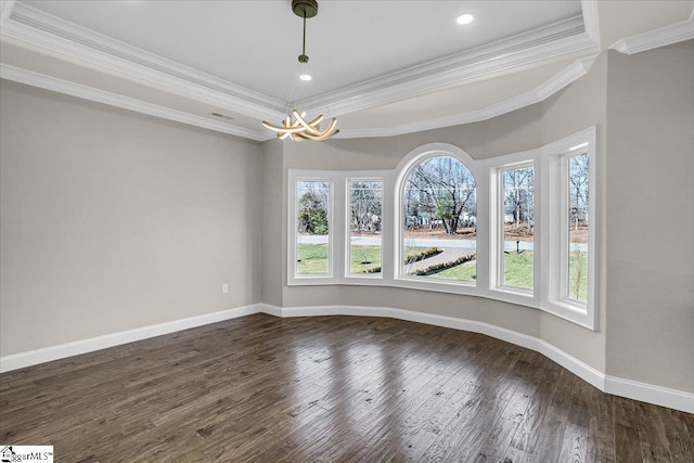 unfurnished room featuring crown molding, dark hardwood / wood-style flooring, and a notable chandelier