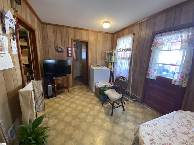 interior space featuring washer / clothes dryer, crown molding, and wooden walls