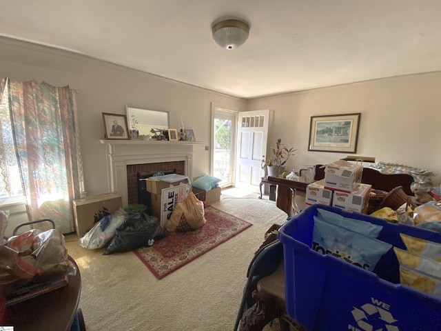 carpeted living room with a fireplace