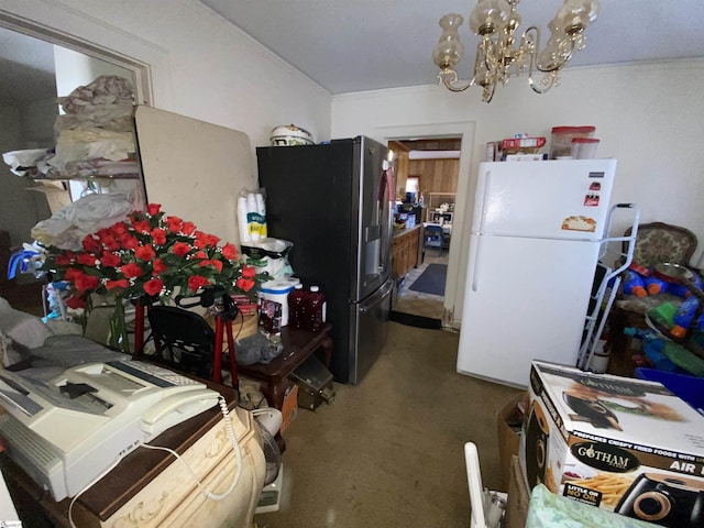 kitchen featuring stainless steel fridge with ice dispenser, white fridge, and a notable chandelier