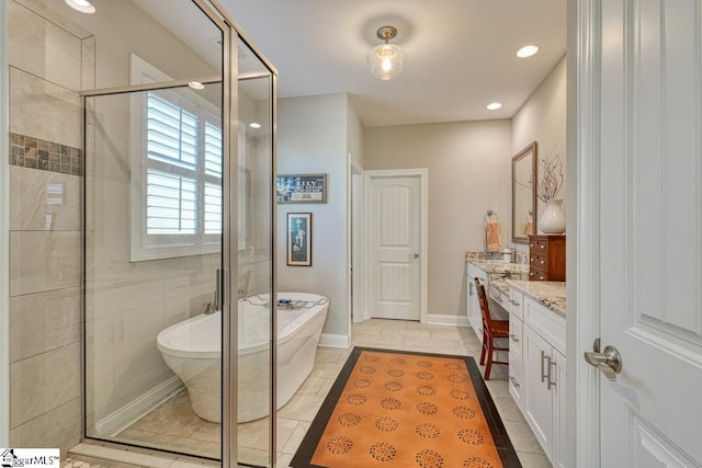 bathroom featuring vanity, tile patterned floors, and plus walk in shower