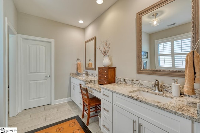 bathroom with vanity and tile patterned flooring