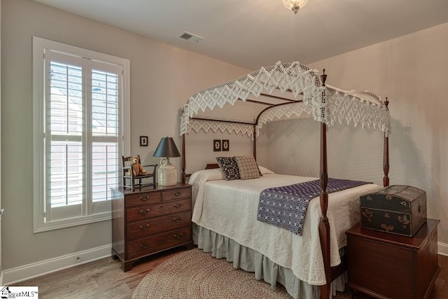 bedroom featuring wood-type flooring