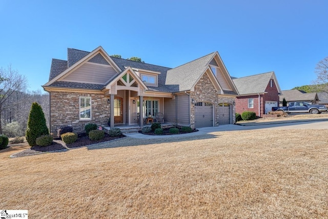 craftsman-style house featuring a garage and covered porch