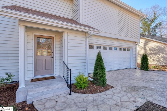 doorway to property featuring a garage