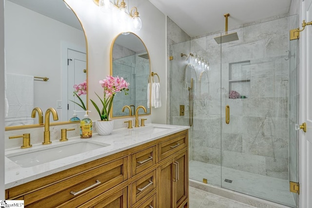 bathroom with vanity and a shower with shower door