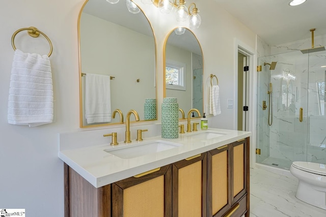 bathroom featuring vanity, toilet, and walk in shower