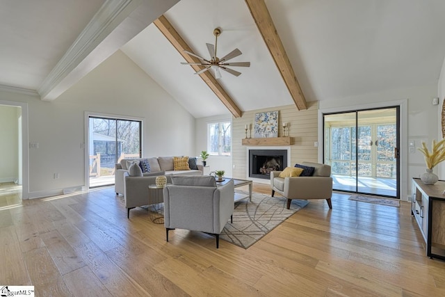 living room featuring beam ceiling, ceiling fan, high vaulted ceiling, and light hardwood / wood-style floors