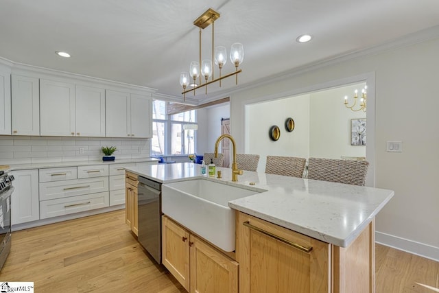 kitchen with sink, an island with sink, white cabinets, and appliances with stainless steel finishes