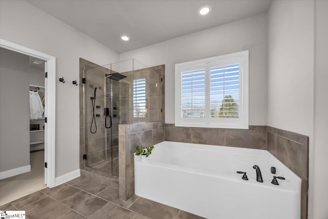 bathroom featuring independent shower and bath and tile patterned flooring