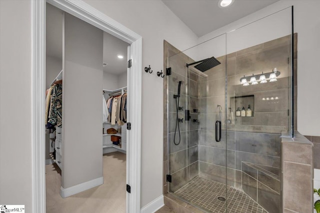 bathroom with a shower with door