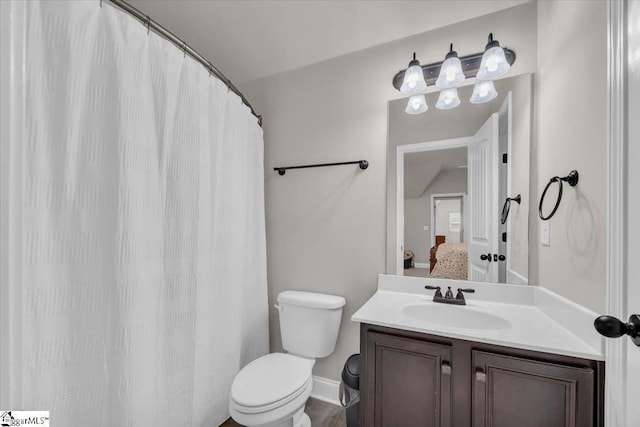 bathroom featuring vanity and toilet