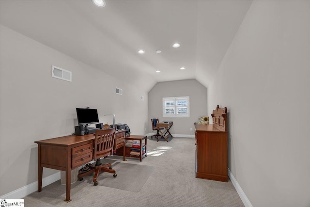 office area with light colored carpet and lofted ceiling