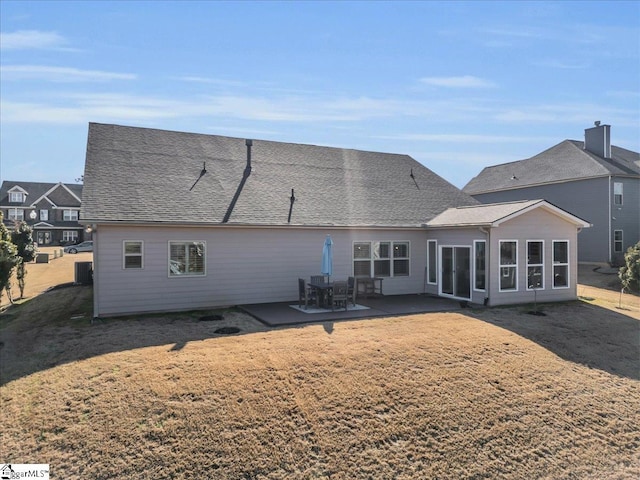 back of house with a patio