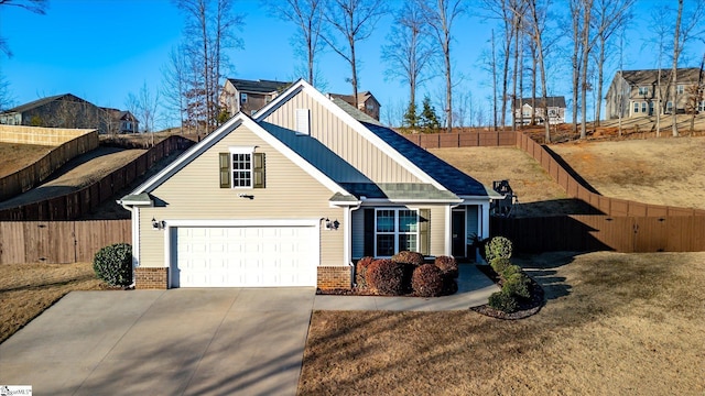 view of front of home with a garage and a front yard