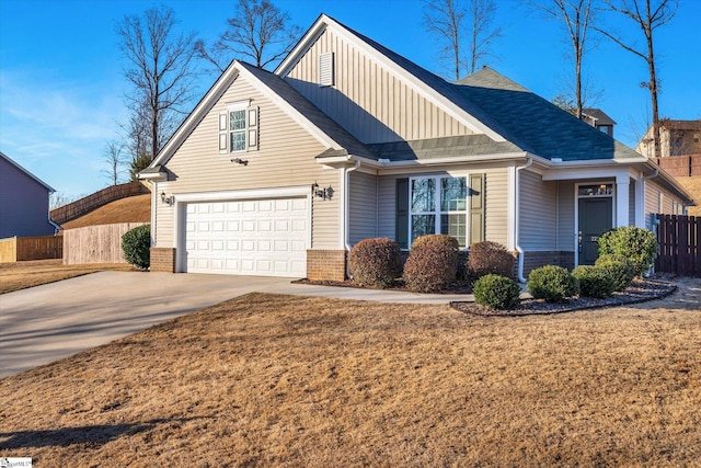 view of front of home featuring a garage and a front lawn