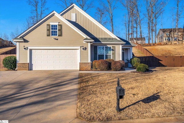 view of front of house featuring a garage and a front lawn