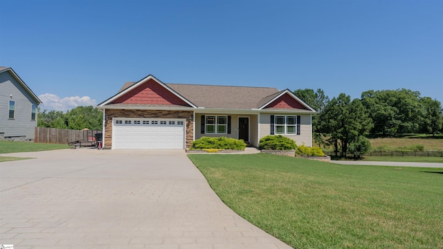 view of front of house with a garage and a front yard