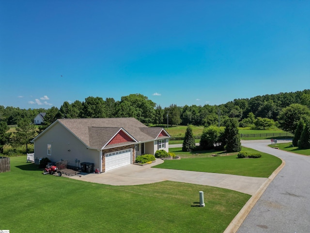 view of front facade featuring a garage and a front lawn