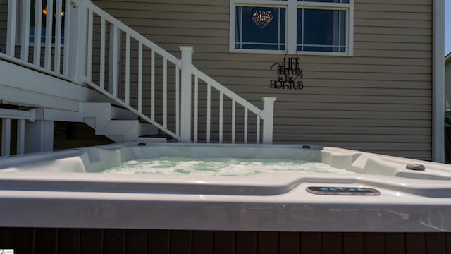 exterior space with a hot tub