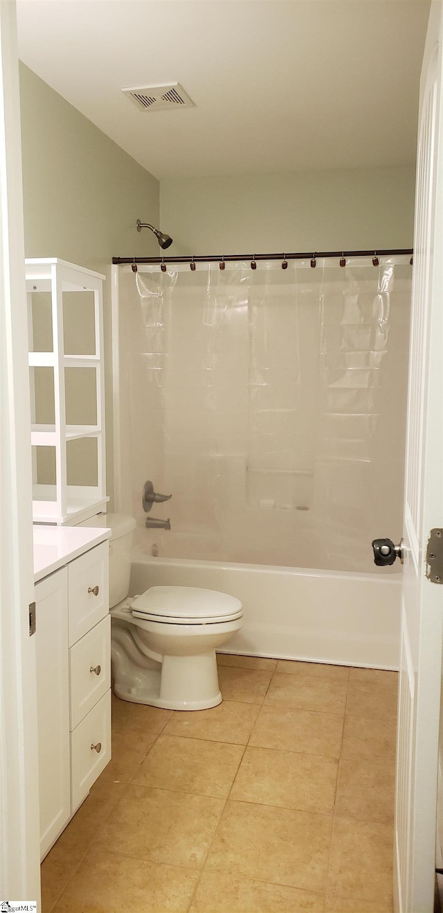 full bathroom with vanity, bathing tub / shower combination, tile patterned floors, and toilet