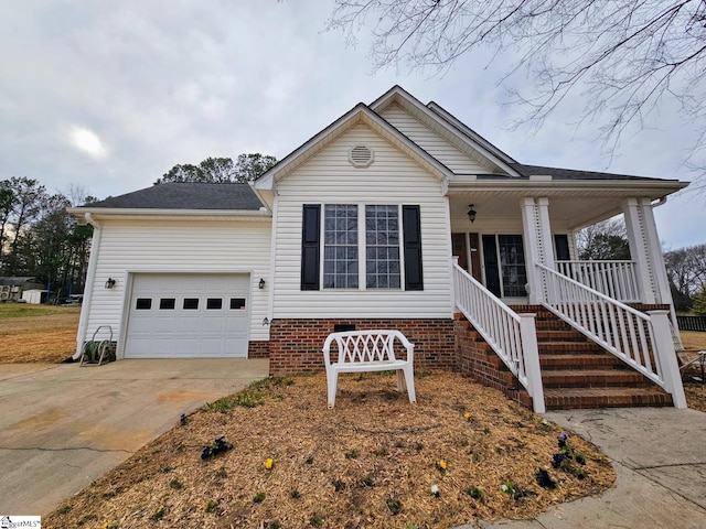 view of front of property with a garage and a porch