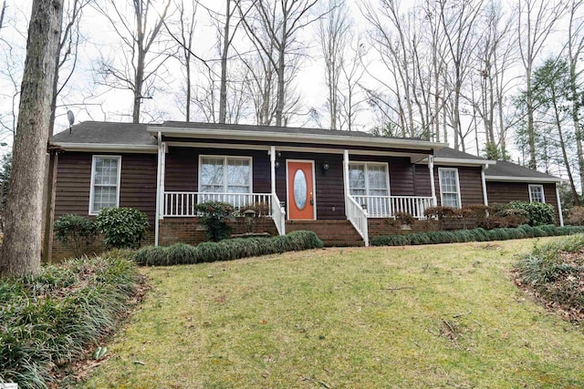 ranch-style house with a front yard and a porch