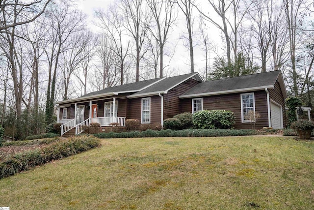 ranch-style house with a garage and a front lawn