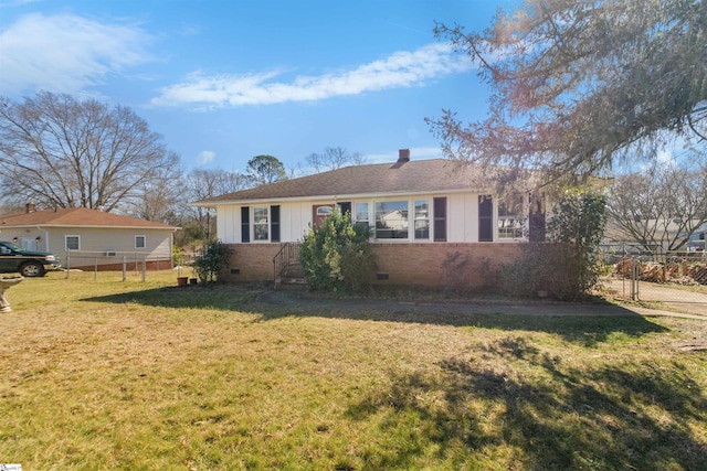 single story home featuring a front lawn