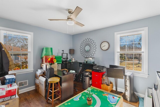 office with ceiling fan and dark hardwood / wood-style flooring