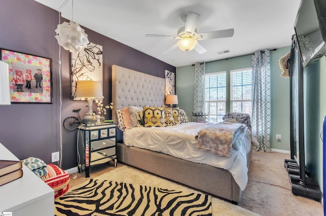 bedroom with ceiling fan and carpet