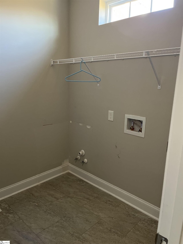 clothes washing area with hookup for a washing machine and hookup for a gas dryer