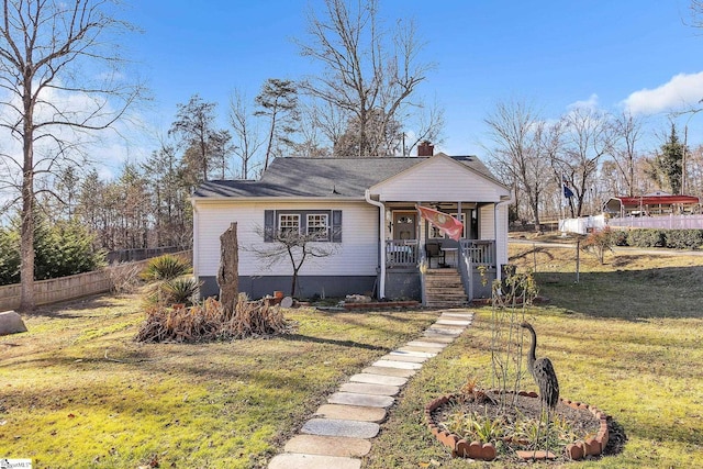 view of front of house featuring a porch and a front lawn