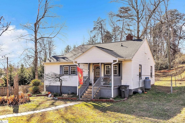 bungalow-style house featuring a front yard