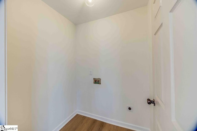 clothes washing area with washer hookup, hardwood / wood-style floors, and hookup for an electric dryer