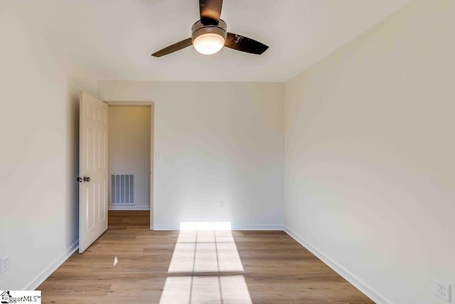 spare room featuring ceiling fan and light wood-type flooring