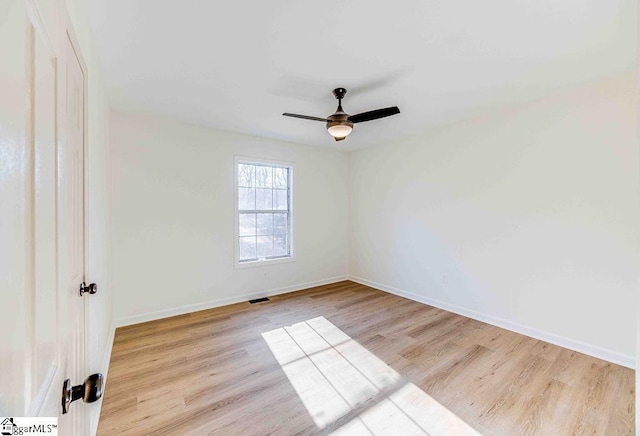 spare room with ceiling fan and light hardwood / wood-style flooring