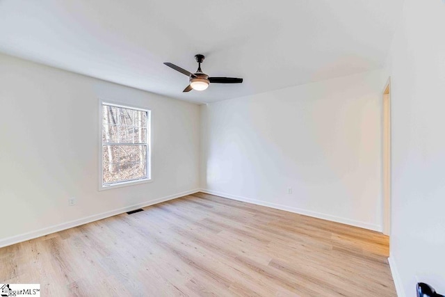 unfurnished room with ceiling fan and light wood-type flooring