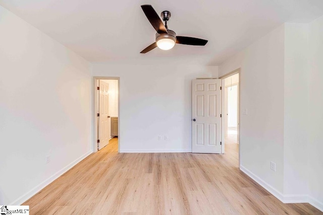 unfurnished bedroom featuring light hardwood / wood-style floors, ceiling fan, and ensuite bathroom
