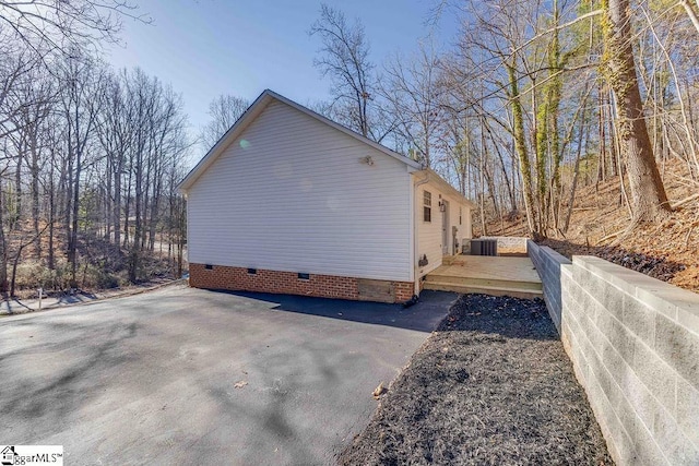 view of property exterior featuring a deck