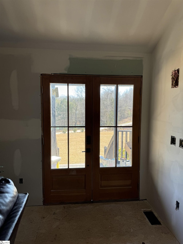 doorway featuring a wealth of natural light and french doors