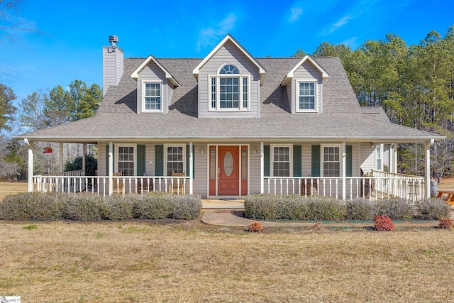 farmhouse inspired home featuring a porch and a front lawn