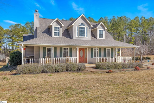 view of front of home featuring covered porch and a front yard