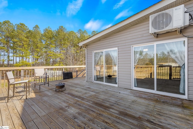 wooden terrace featuring ac unit