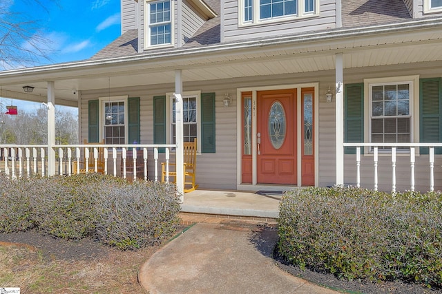 entrance to property featuring covered porch