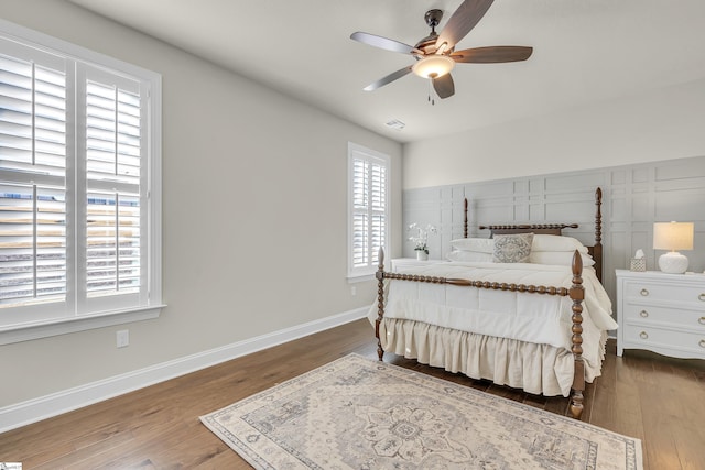 bedroom featuring wood-type flooring and ceiling fan