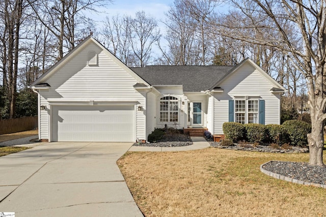 ranch-style home featuring a garage and a front lawn