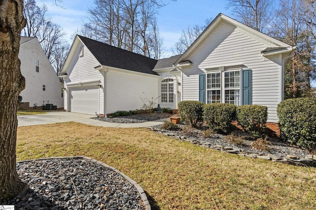 view of front of property with a garage and a front yard