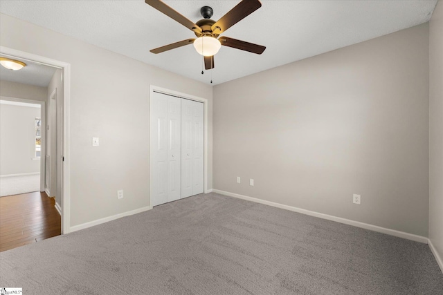 unfurnished bedroom featuring ceiling fan, carpet floors, and a closet