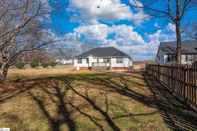 back of house featuring a yard